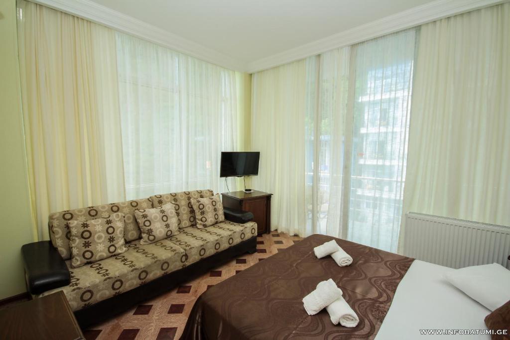 TV a/nebo společenská místnost v ubytování Hotel Cameo