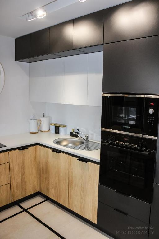 Kuchyňa alebo kuchynka v ubytovaní D Apartments Centrum Prowiantowa II