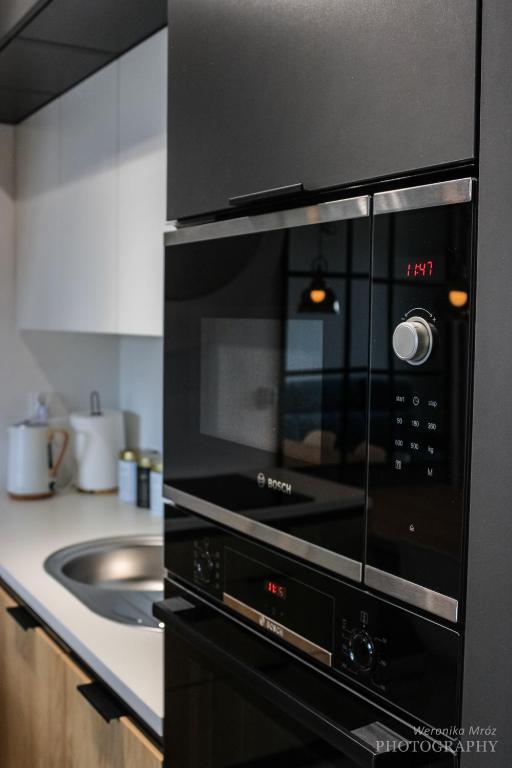 Kuchyňa alebo kuchynka v ubytovaní D Apartments Centrum Prowiantowa II