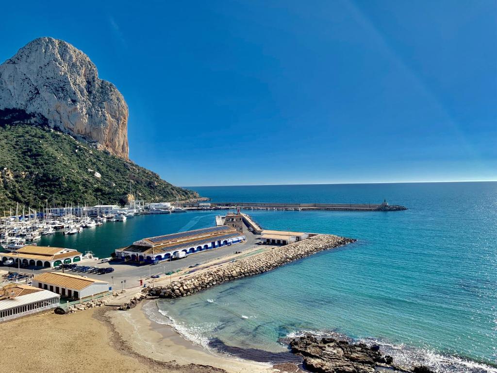 a beach with a bunch of boats in the water at Paradero Rental B75 Vistas al Mar in Calpe