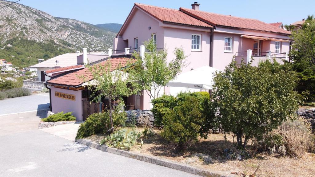 a house on the side of a road at BMB Apartments in Senj