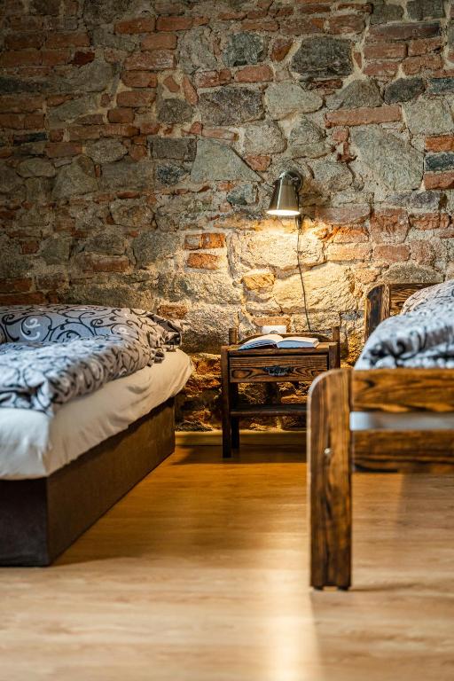 A bed or beds in a room at Apartman Belavita