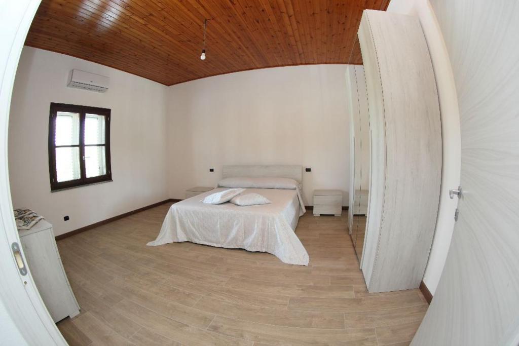 Postel nebo postele na pokoji v ubytování LA PACE DEGLI AGRUMI