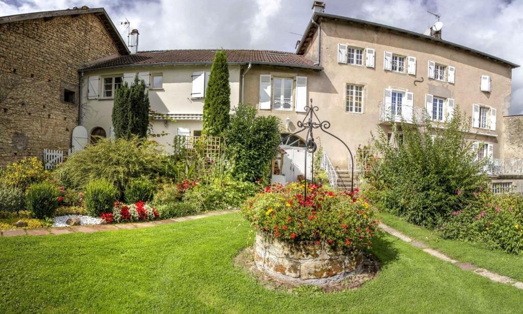 a large house with a garden in front of it at CHEZ PIERRE in Remoncourt