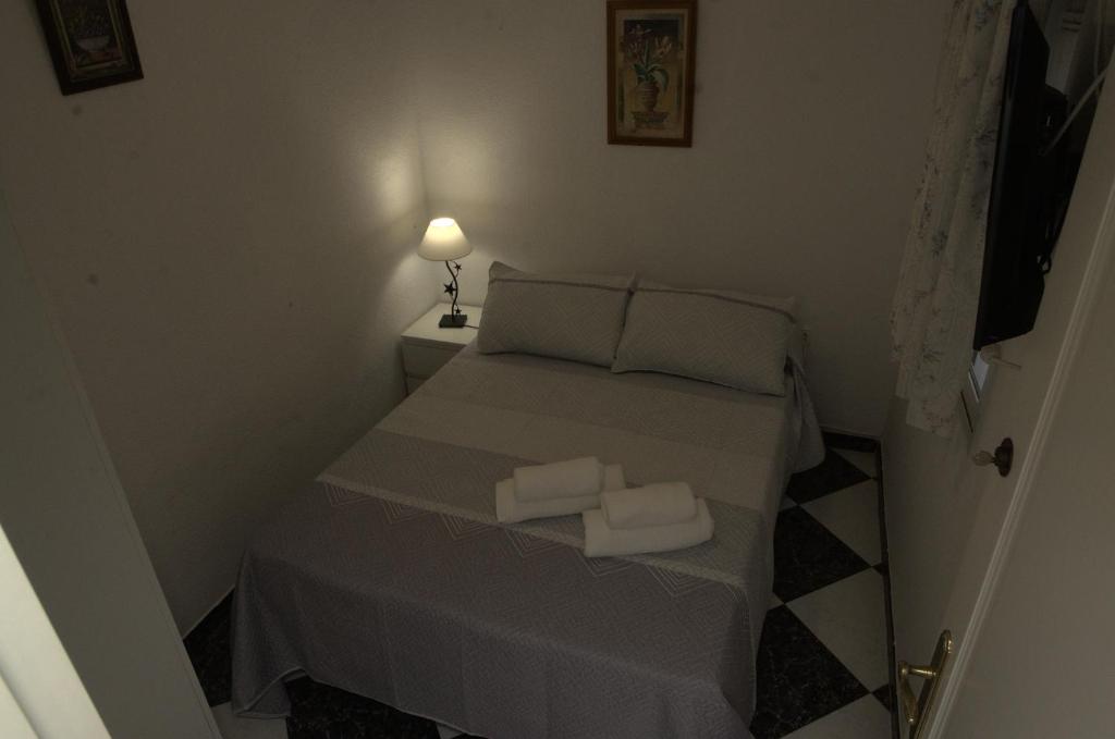 Posteľ alebo postele v izbe v ubytovaní Habitación en el corazón del centro de Malaga