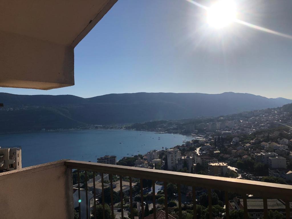 a view of a lake from a balcony at Korra in Herceg-Novi
