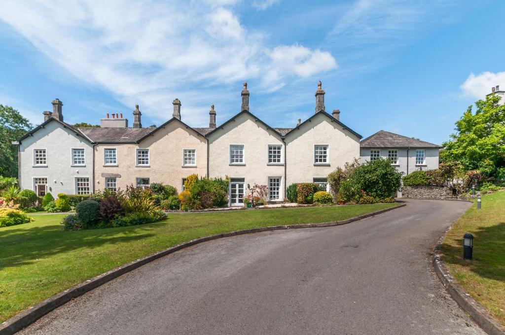 a large house with a driveway in front of it at 8 Kents Bank House in Grange