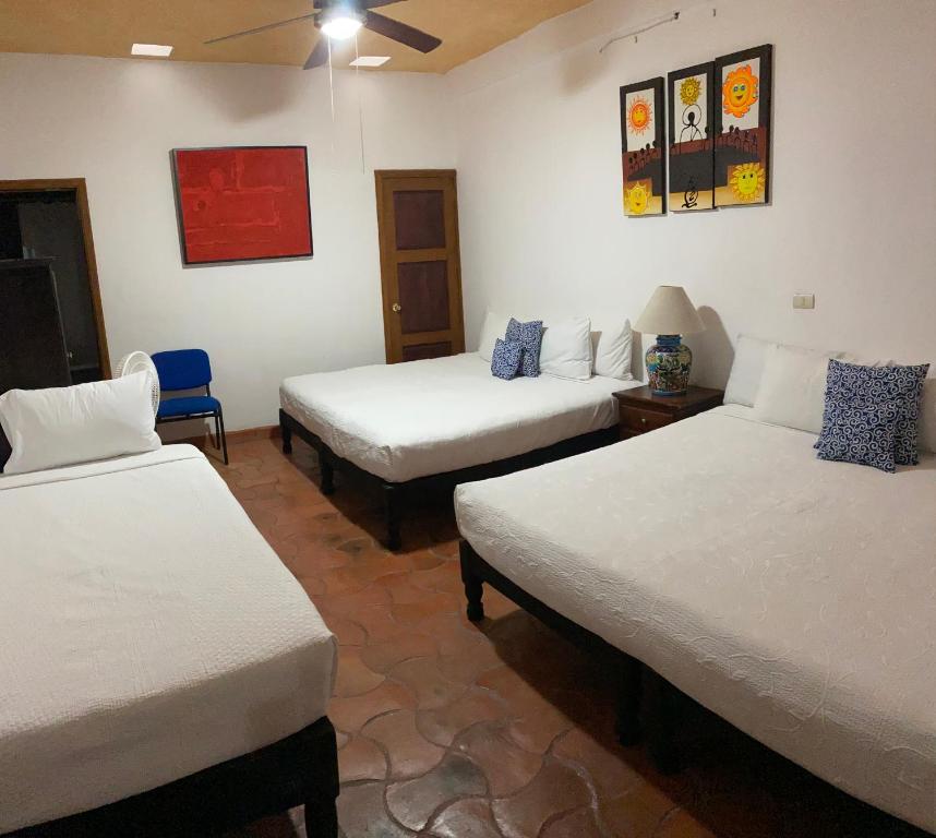 Postel nebo postele na pokoji v ubytování Hotel del Sol