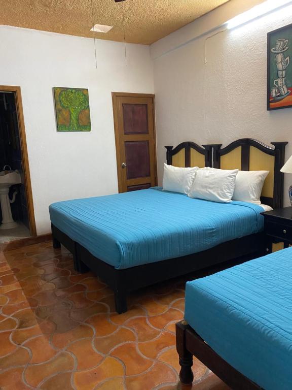 Postel nebo postele na pokoji v ubytování Hotel del Sol