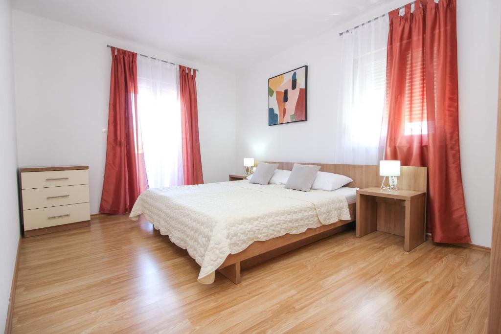 Posteľ alebo postele v izbe v ubytovaní Apartments Lotta