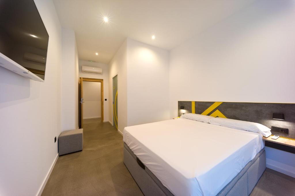 Postel nebo postele na pokoji v ubytování Konk Hostel