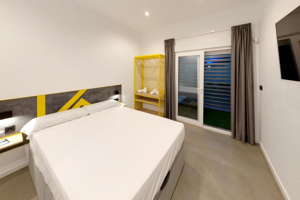 Postel nebo postele na pokoji v ubytování Konk Hostel