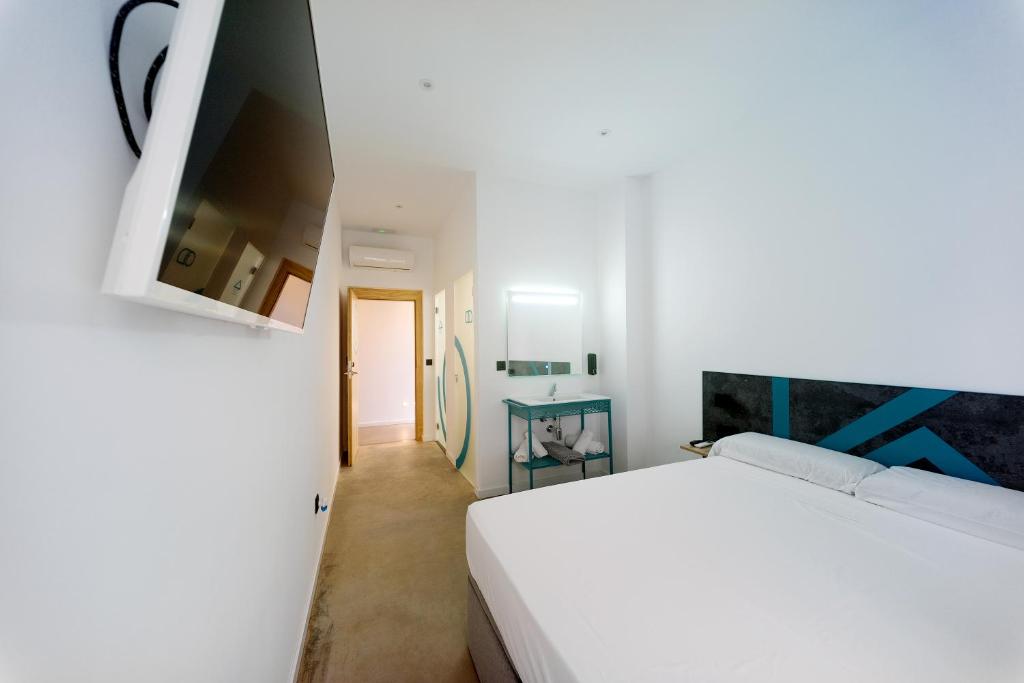 Postel nebo postele na pokoji v ubytování Konk Hostel