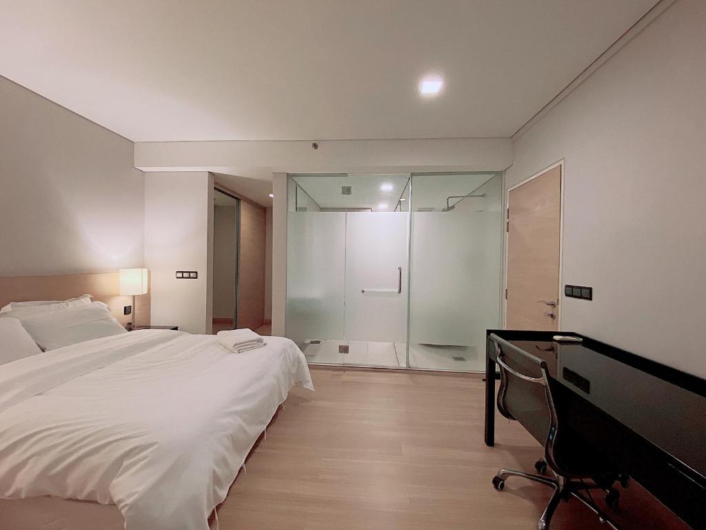 Postel nebo postele na pokoji v ubytování Straits Suite by C Homestay Malacca