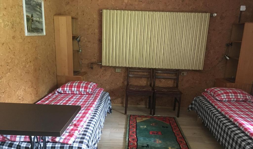 Postel nebo postele na pokoji v ubytování Voosemetsa Turismitalu