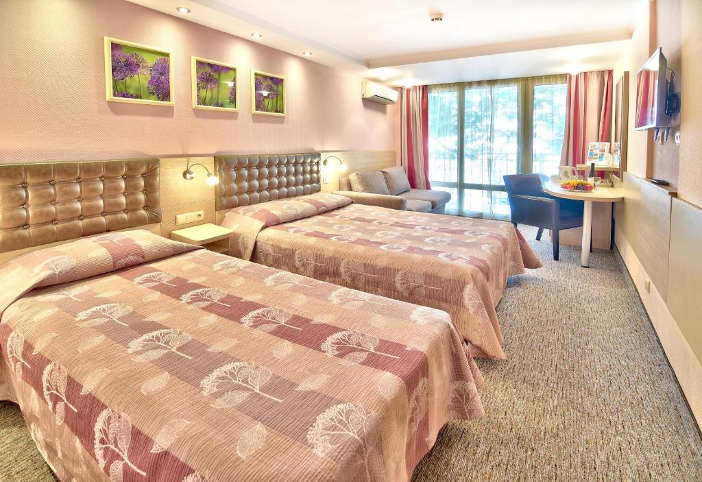 Postel nebo postele na pokoji v ubytování Hotel Sandy Beach
