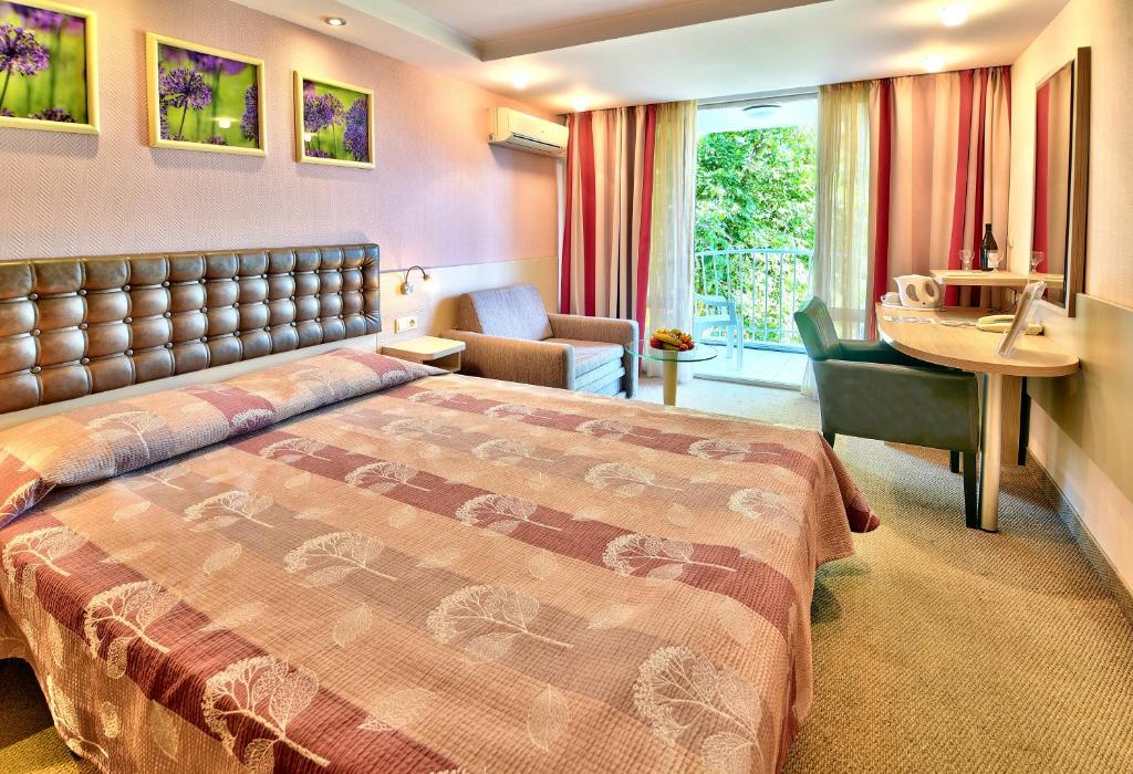 Postel nebo postele na pokoji v ubytování Hotel Sandy Beach