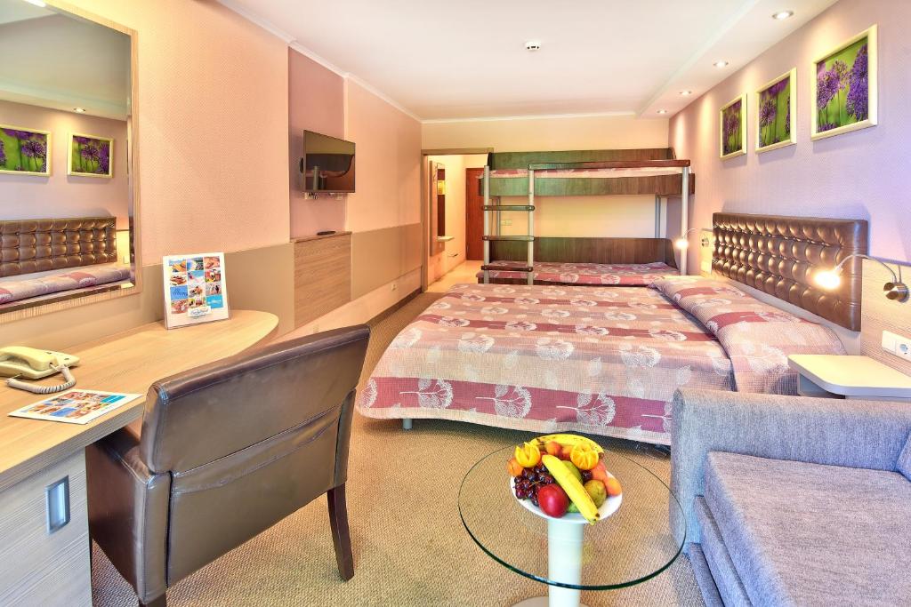 Postel nebo postele na pokoji v ubytování Hotel Sandy Beach