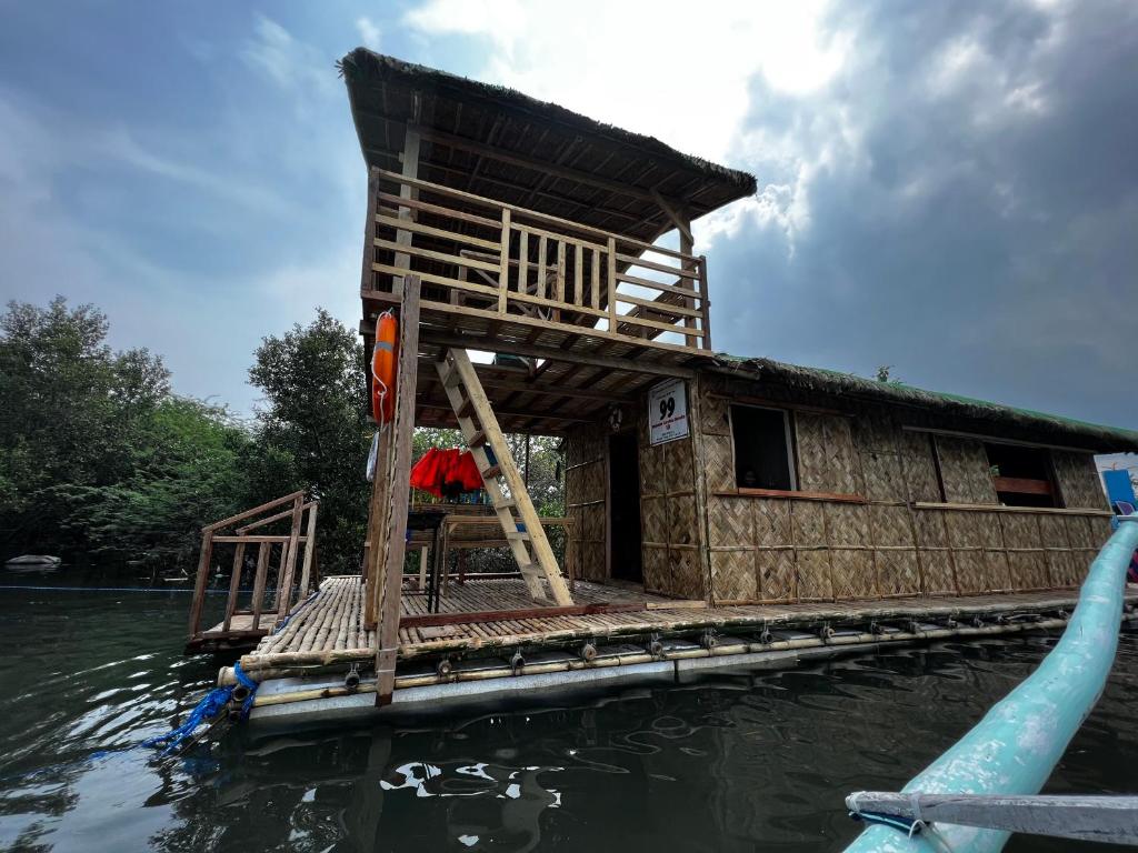a house on a raft in the water at Onyong's Floating Cottage in Calatagan
