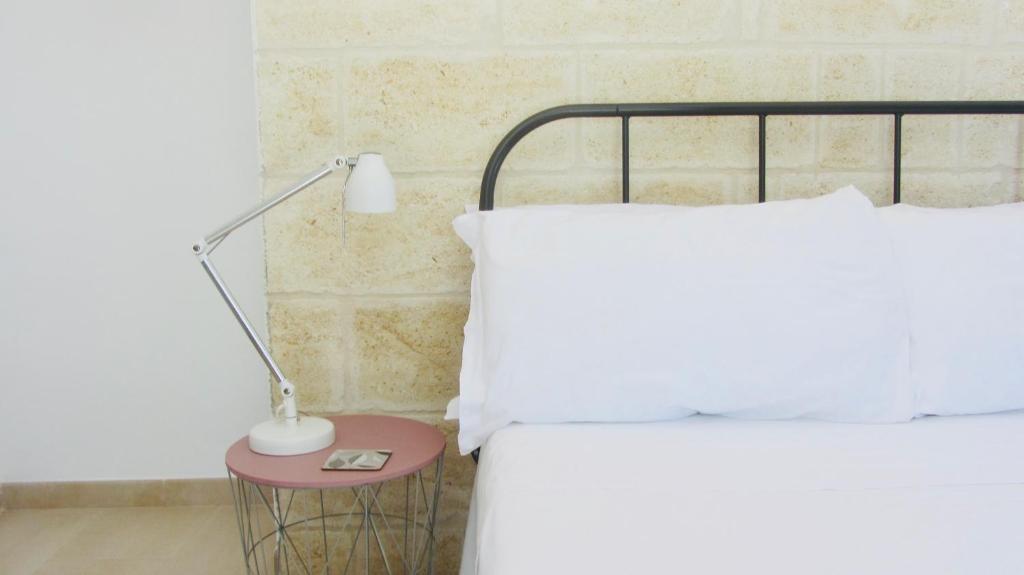 Postel nebo postele na pokoji v ubytování Casa della Scrittrice