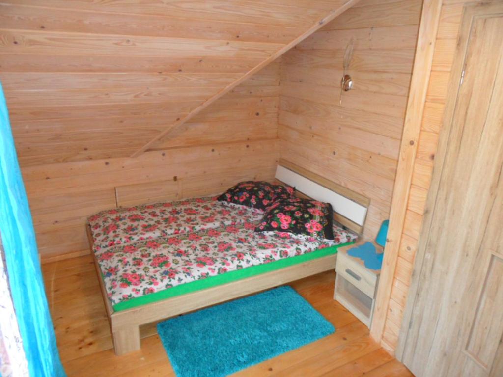Postel nebo postele na pokoji v ubytování Domki pod Pilskiem