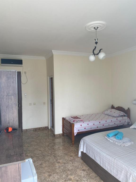 Postel nebo postele na pokoji v ubytování Badu Guest House