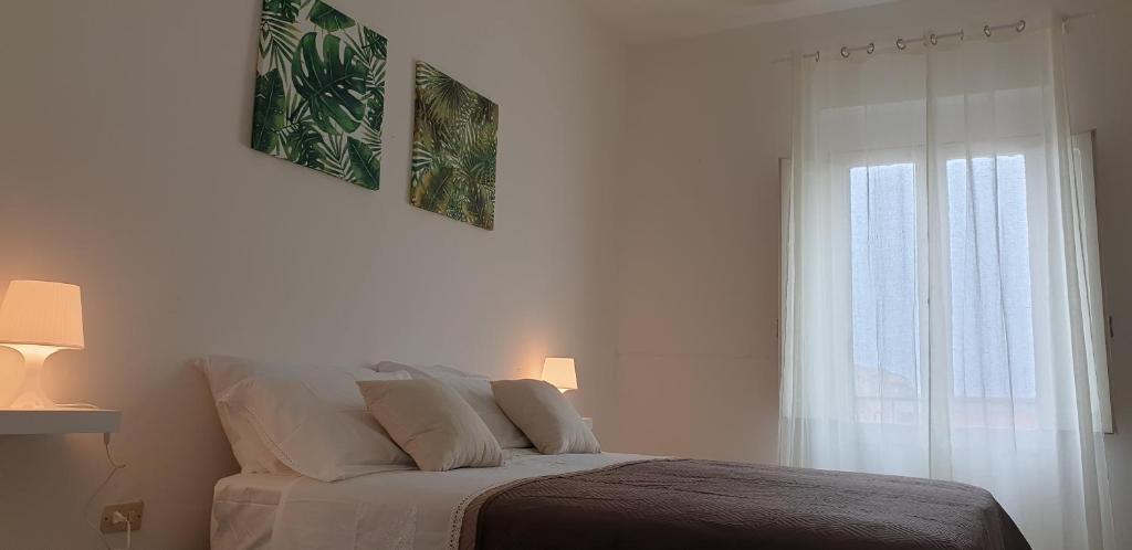 A bed or beds in a room at CASA VACANZE PIAZZA MALTA