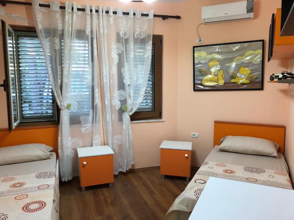Postel nebo postele na pokoji v ubytování Vila MeriS