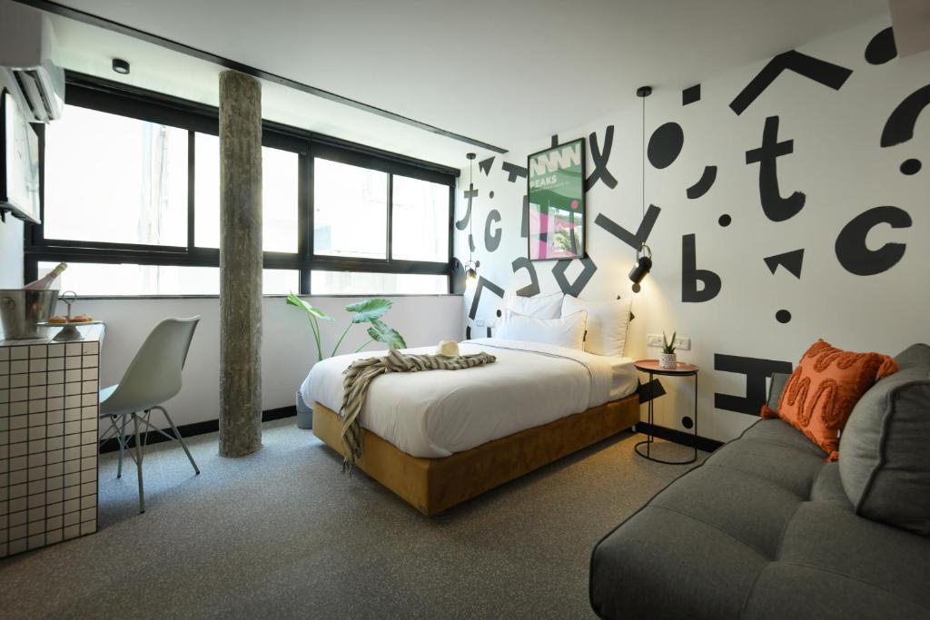 Postel nebo postele na pokoji v ubytování Pixel - by Loginn Tel-Avivian hotels
