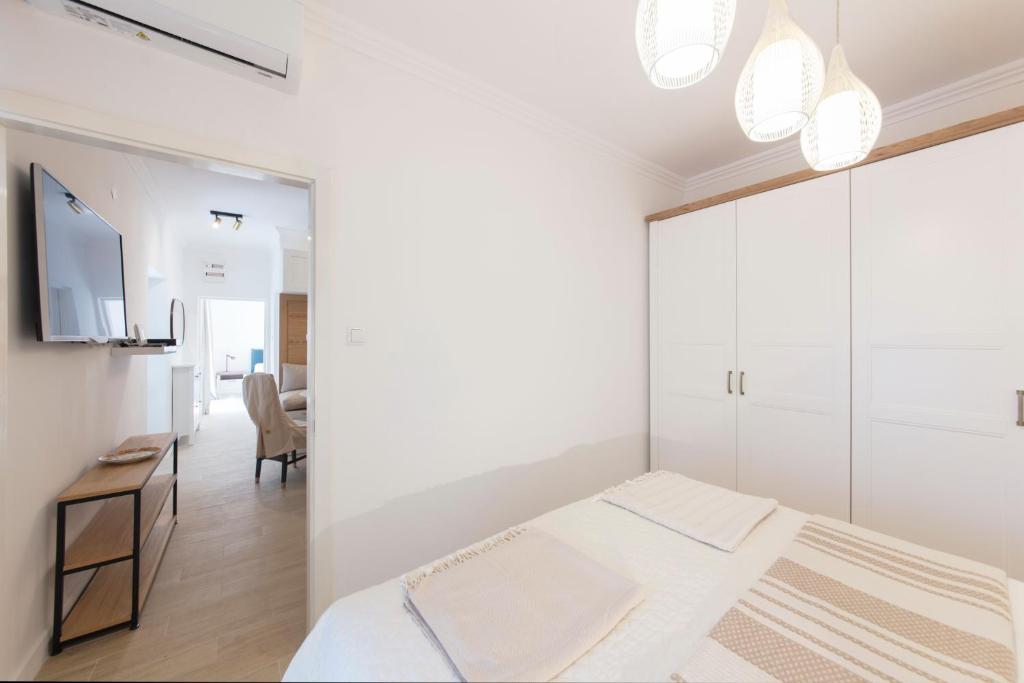 Un ou plusieurs lits dans un hébergement de l'établissement Spring Apartment