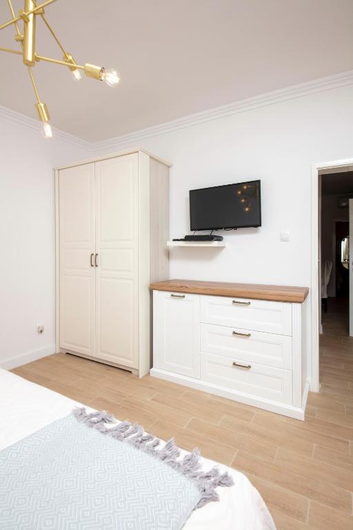 Télévision ou salle de divertissement dans l'établissement Spring Apartment