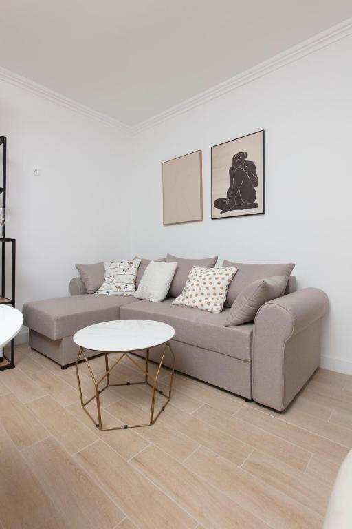 Coin salon dans l'établissement Spring Apartment