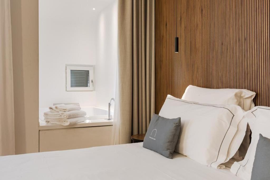 Postel nebo postele na pokoji v ubytování Hotel Casa Scaligeri