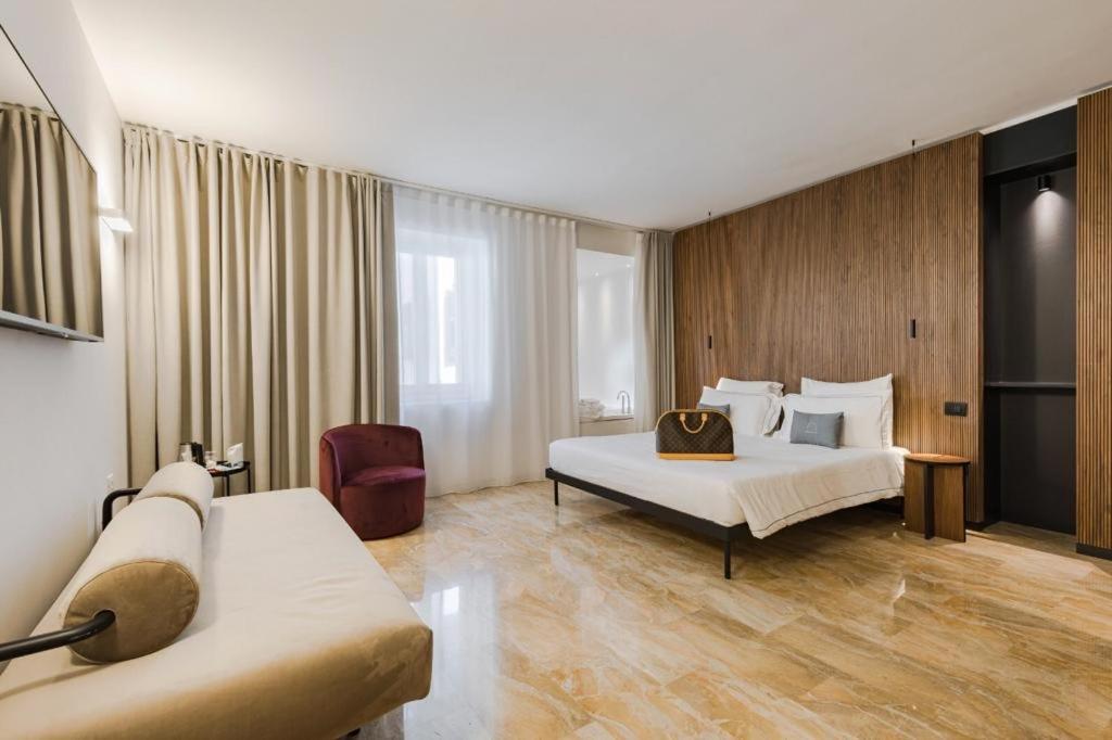Postel nebo postele na pokoji v ubytování Hotel Casa Scaligeri