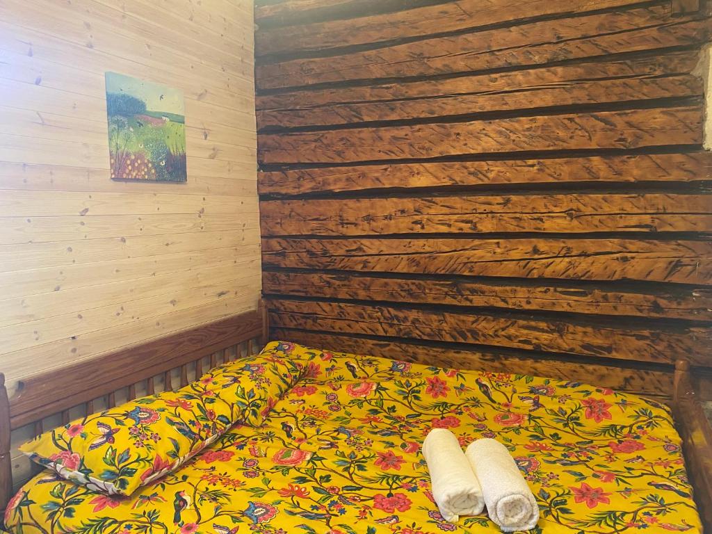 a bed with two towels on it in a room at Private Hiiumaa Cottage plus Sauna in Lelu