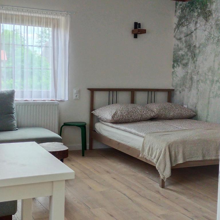 Postel nebo postele na pokoji v ubytování Apartamenty Heweliusz House