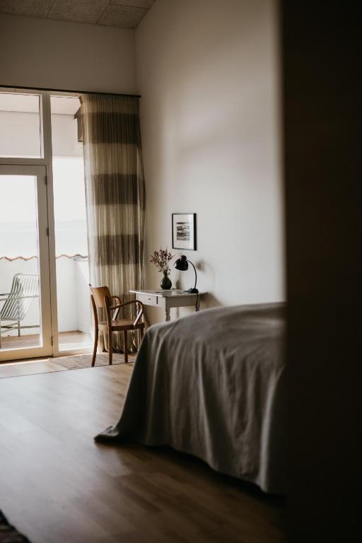 Postel nebo postele na pokoji v ubytování Langhoff & Juul Boutique Hotel og Restaurant