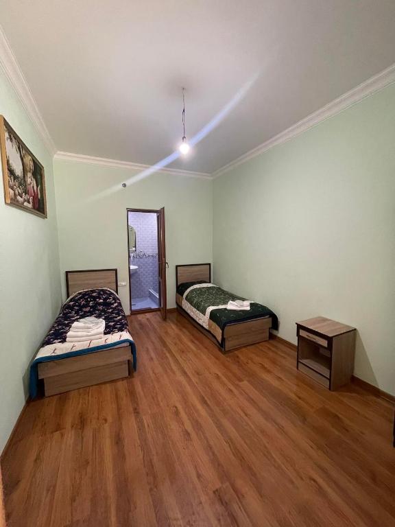 Postel nebo postele na pokoji v ubytování Old Jermuk
