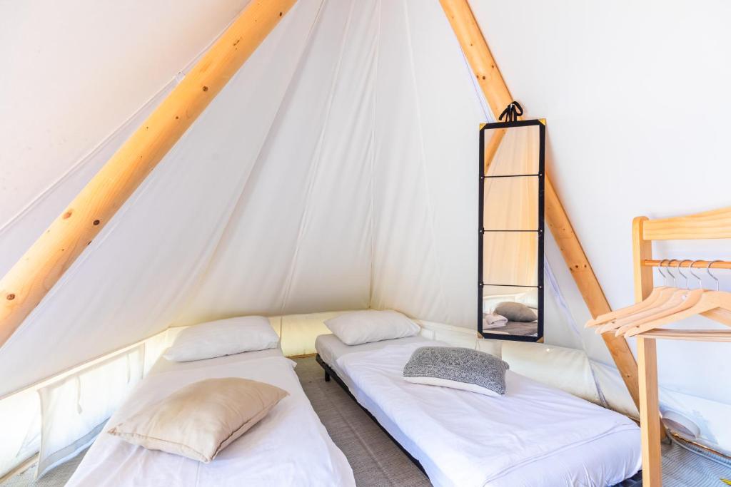 Postel nebo postele na pokoji v ubytování O-Tents by Obonjan Island Resort