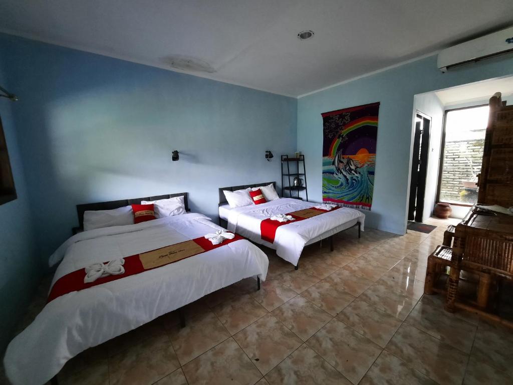Postel nebo postele na pokoji v ubytování HOTEL BESAR BULAN BARU - Senggigi