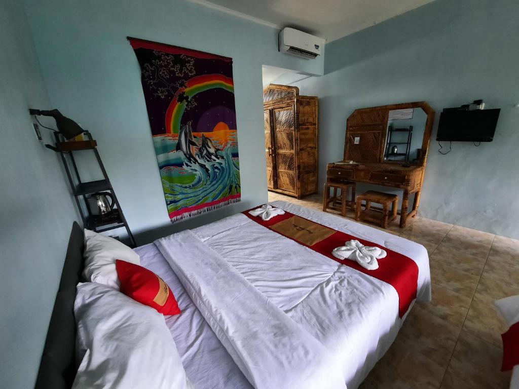 TV a/nebo společenská místnost v ubytování HOTEL BESAR BULAN BARU - Senggigi