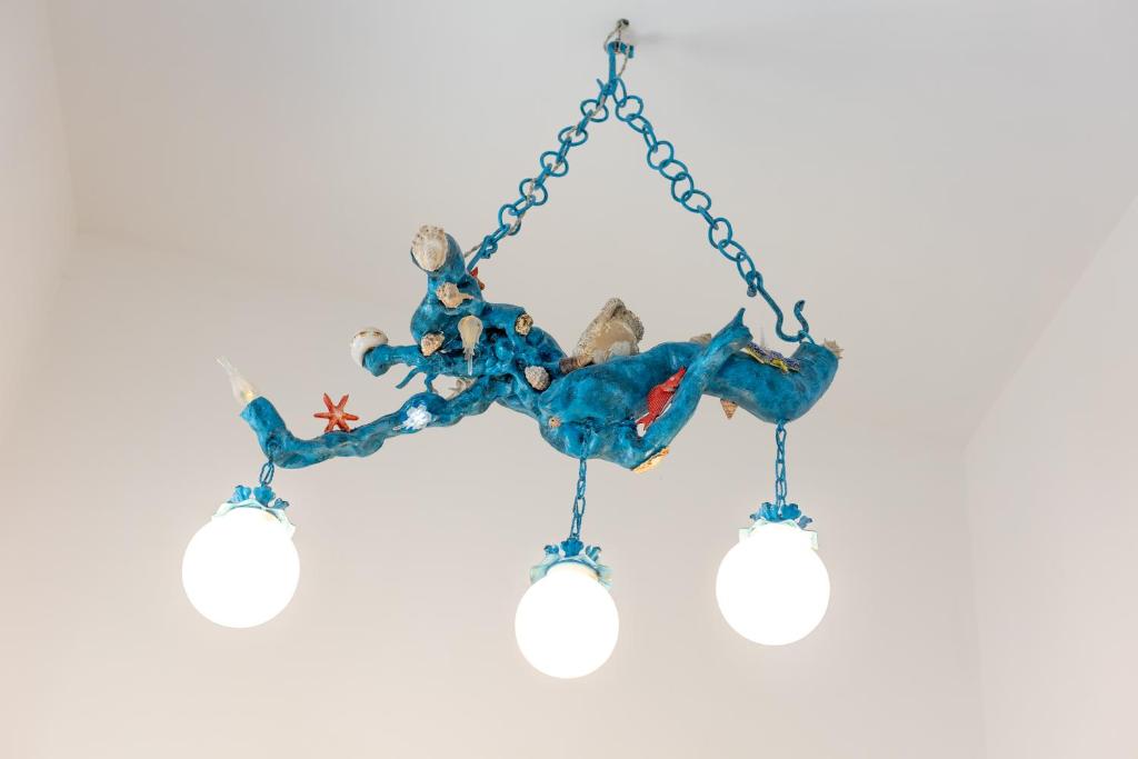 a blue crab chime hanging from a chain at La Bella Annacapri in Anacapri