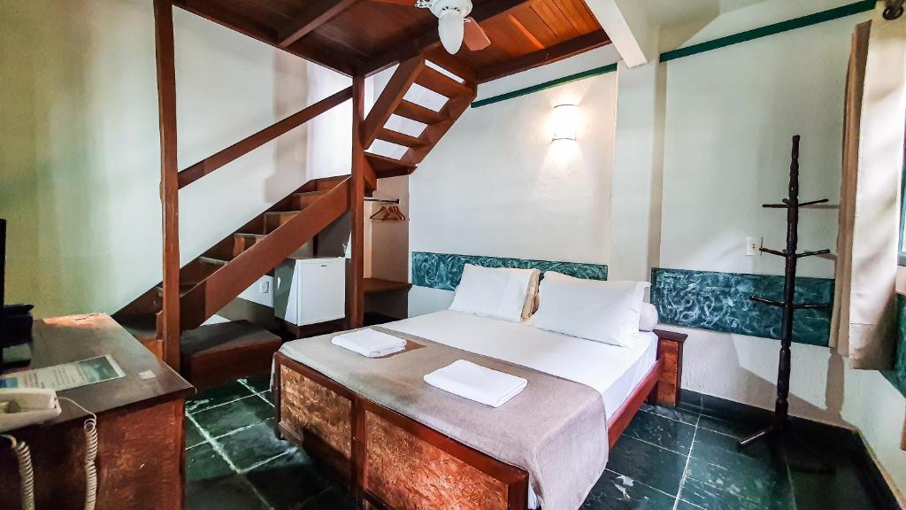 Cama ou camas em um quarto em Pousada Monte Azul
