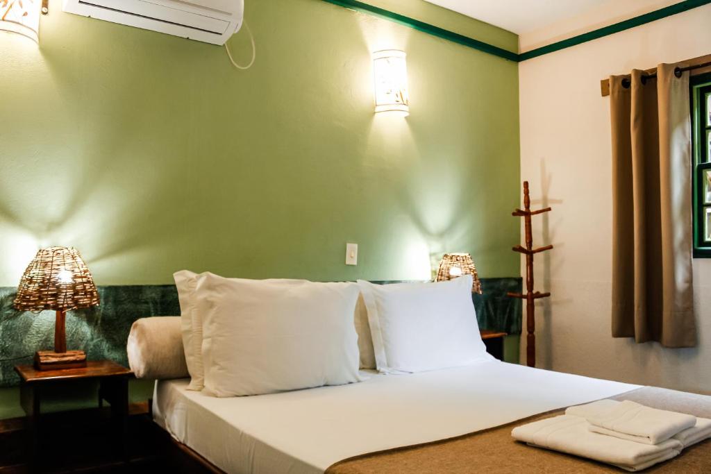 Cama ou camas em um quarto em Pousada Monte Azul
