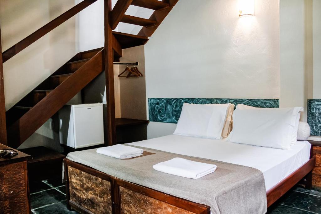 Cama ou camas em um quarto em Pousada Monte Azul