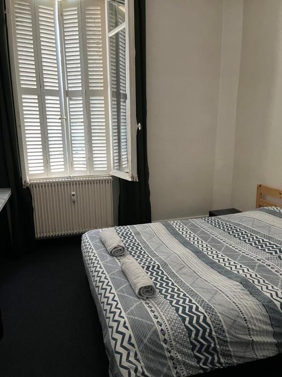 Postel nebo postele na pokoji v ubytování studio Gare beauvoisine parking gratuit