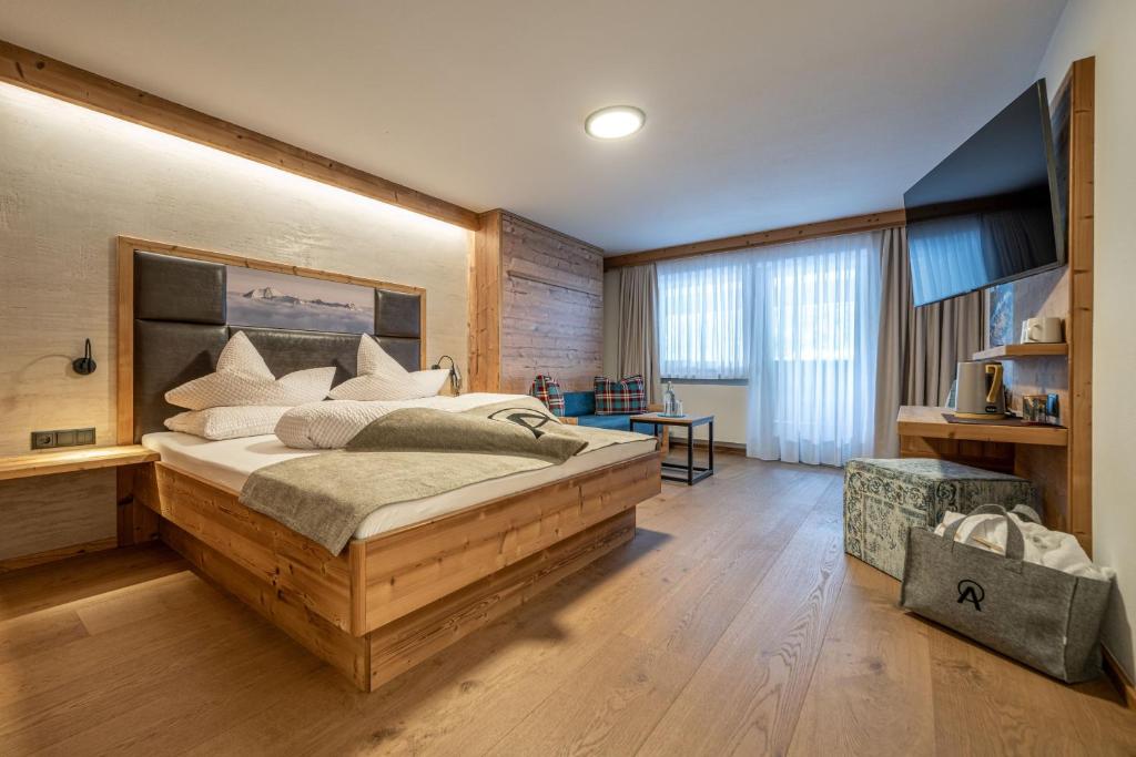 Postel nebo postele na pokoji v ubytování Genusshotel Alpenblick