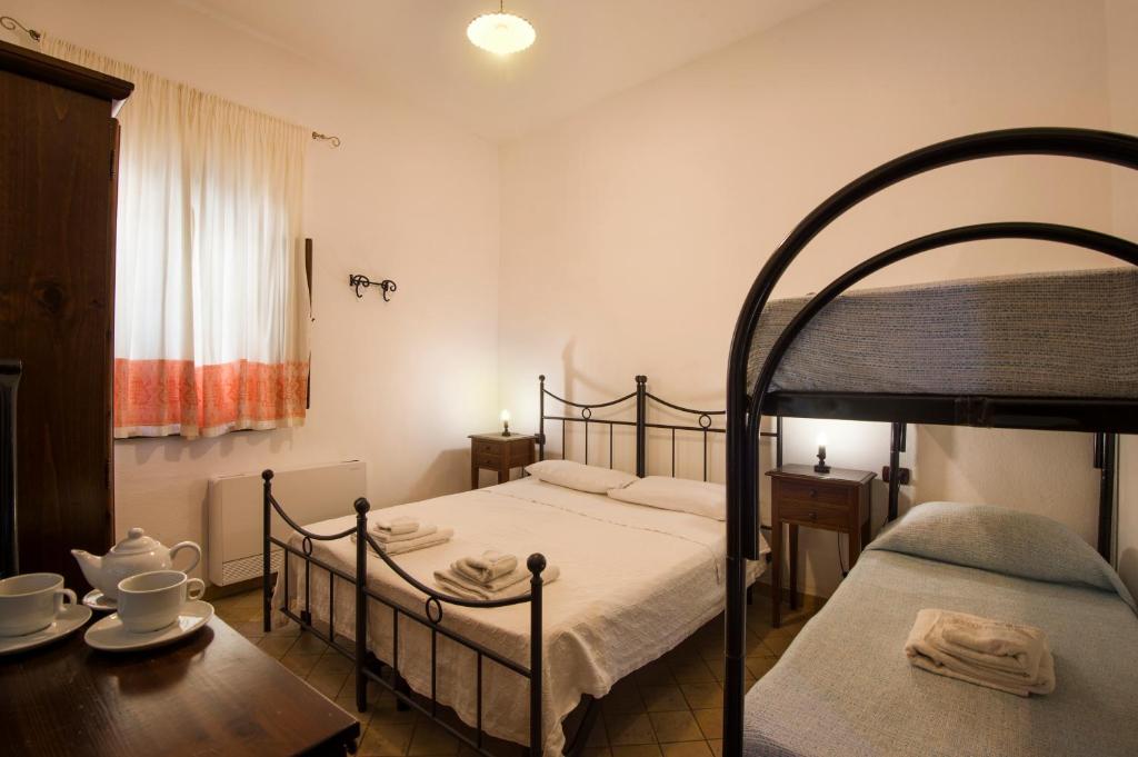 Postel nebo postele na pokoji v ubytování Antico Borgo