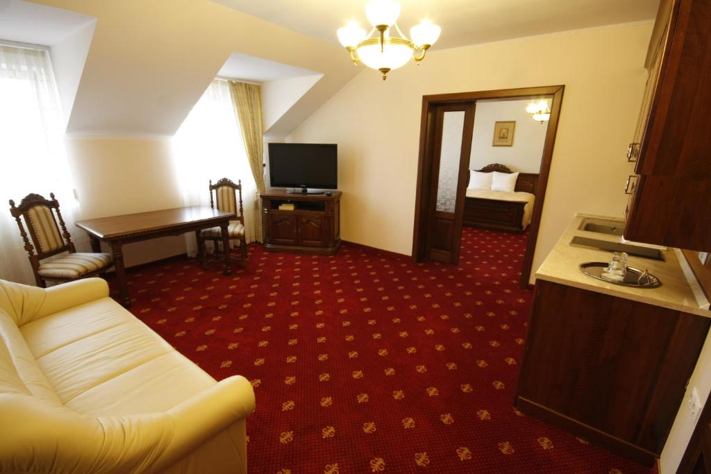 TV a/nebo společenská místnost v ubytování Hotel Slavia