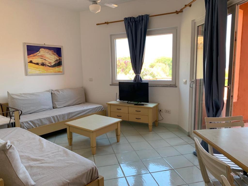 Postel nebo postele na pokoji v ubytování Residence Cala Rossa